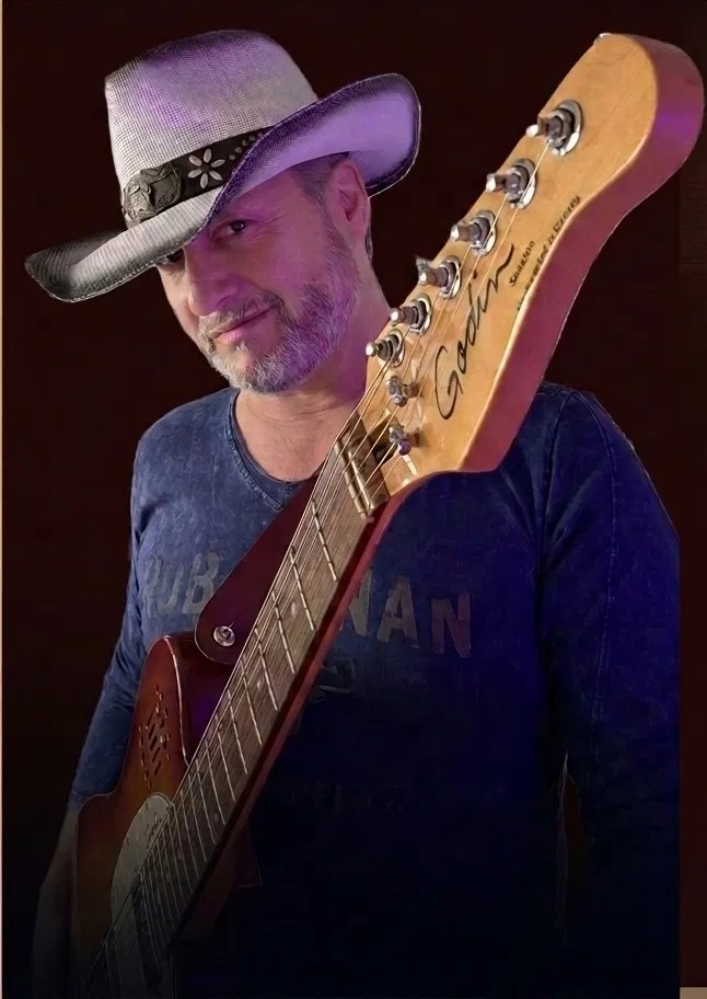Rob Brennan portrait with guitar